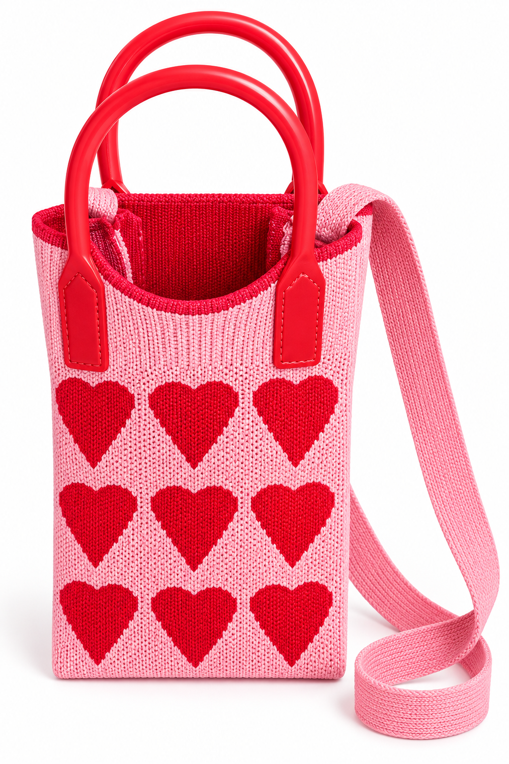 Pink knit purse with red heart pattern shown from above, with red handles and shoulder strap