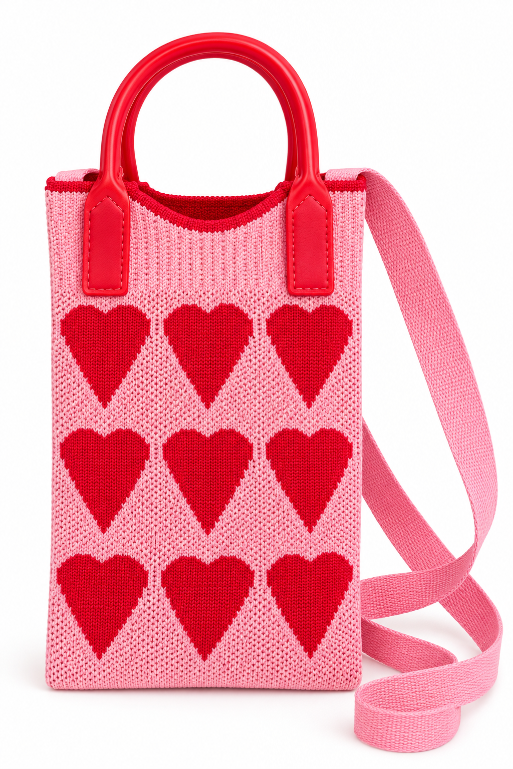 Front view of a pink knit purse with red hearts, red top handles, and a pink shoulder strap
